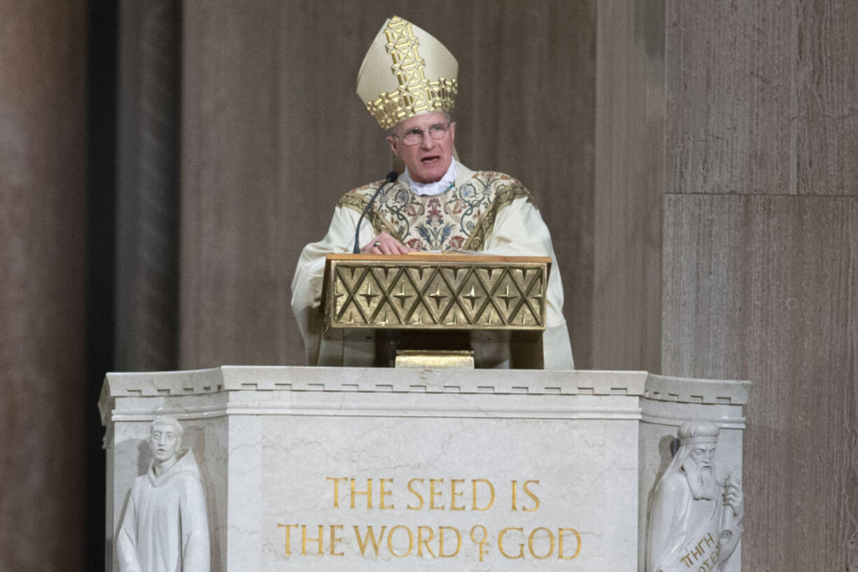 FILE - Archbishop Timothy Broglio conducts an Easter Sunday Mass at Basilica of the National Shrine of the Immaculate Conception in Washington, April 12, 2020. The leader of the nation's Catholic bishops weighed in on ongoing immigration issues Thursday, June 15, 2023, calling for effective border management while emphasizing the church's need to help migrants -- and questioning political leaders who are transporting them to faraway states.