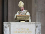 FILE - Archbishop Timothy Broglio conducts an Easter Sunday Mass at Basilica of the National Shrine of the Immaculate Conception in Washington, April 12, 2020. The leader of the nation's Catholic bishops weighed in on ongoing immigration issues Thursday, June 15, 2023, calling for effective border management while emphasizing the church's need to help migrants -- and questioning political leaders who are transporting them to faraway states.