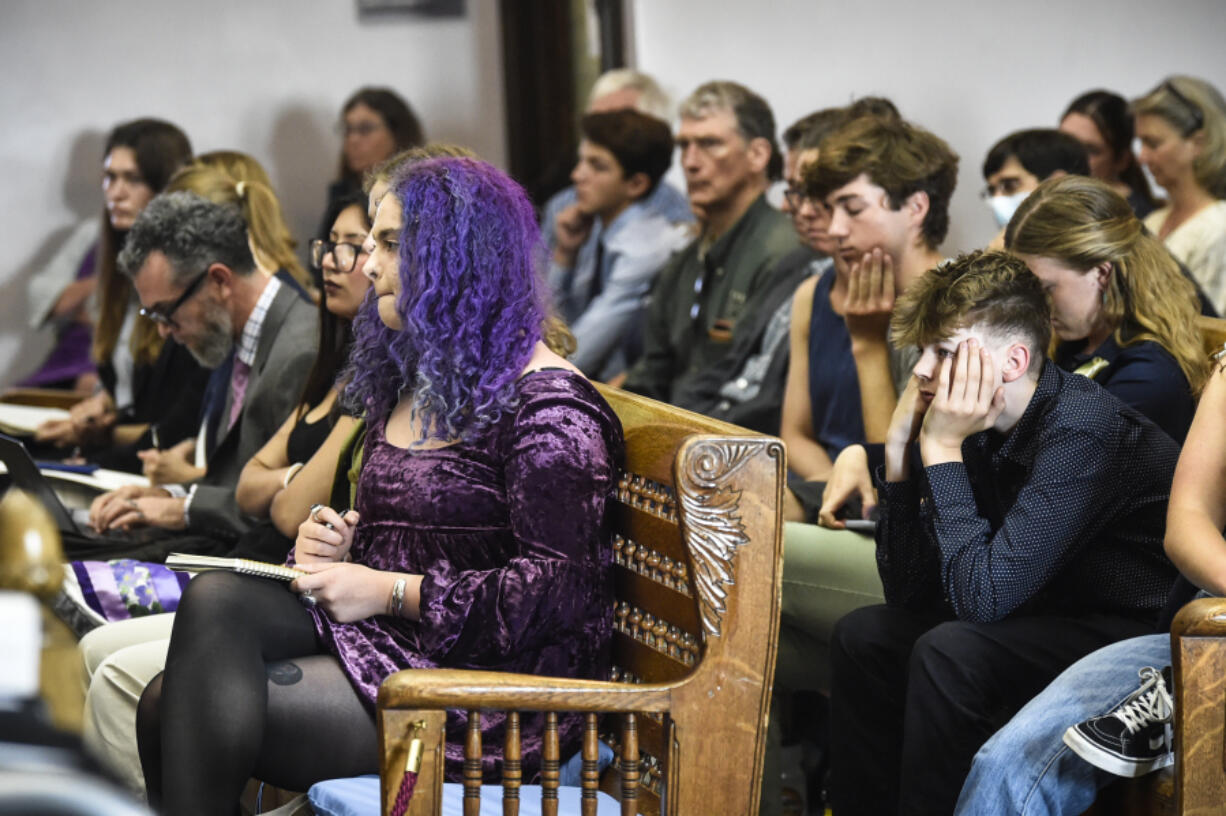 Plaintiffs listen to testimony during a hearing in the climate change lawsuit, Held vs. Montana, at the Lewis and Clark County Courthouse, Tuesday, in Helena, Mont. The 16 young plaintiffs and their attorneys are trying to persuade a judge that the state's allegiance to fossil fuel development endangers the young people's health and livelihoods and those of future generations.