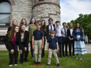 Youth plaintiffs in the climate change lawsuit, Held vs. Montana, pose  outside the Lewis and Clark County Courthouse in Helena, Mont., on Monday, June 12, 2023.