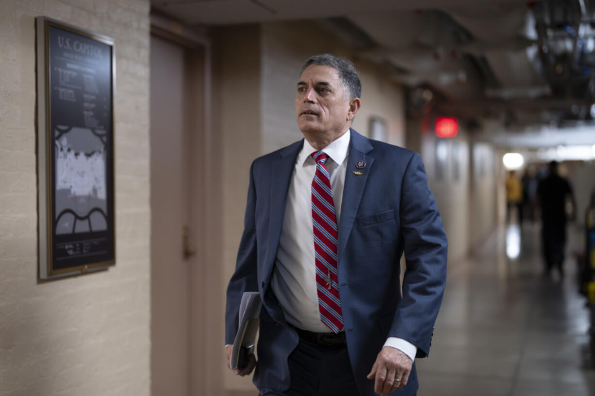 Rep. Andrew Clyde, R-Ga., walks to a closed-door meeting with Speaker of the House Kevin McCarthy, R-Calif., and fellow Republicans, at the Capitol in Washington, Tuesday, June 13, 2023. Last week, Clyde was at the center of protest of McCarthy's leadership as he and a dozen Republicans, mainly members of the House Freedom Caucus, brought the House to a standstill. Clyde is a gun store owner in Georgia and is a sponsor of a bill to reverse a Biden administration firearms-related regulation on so-called pistol braces, a stabilizing feature. (AP Photo/J.