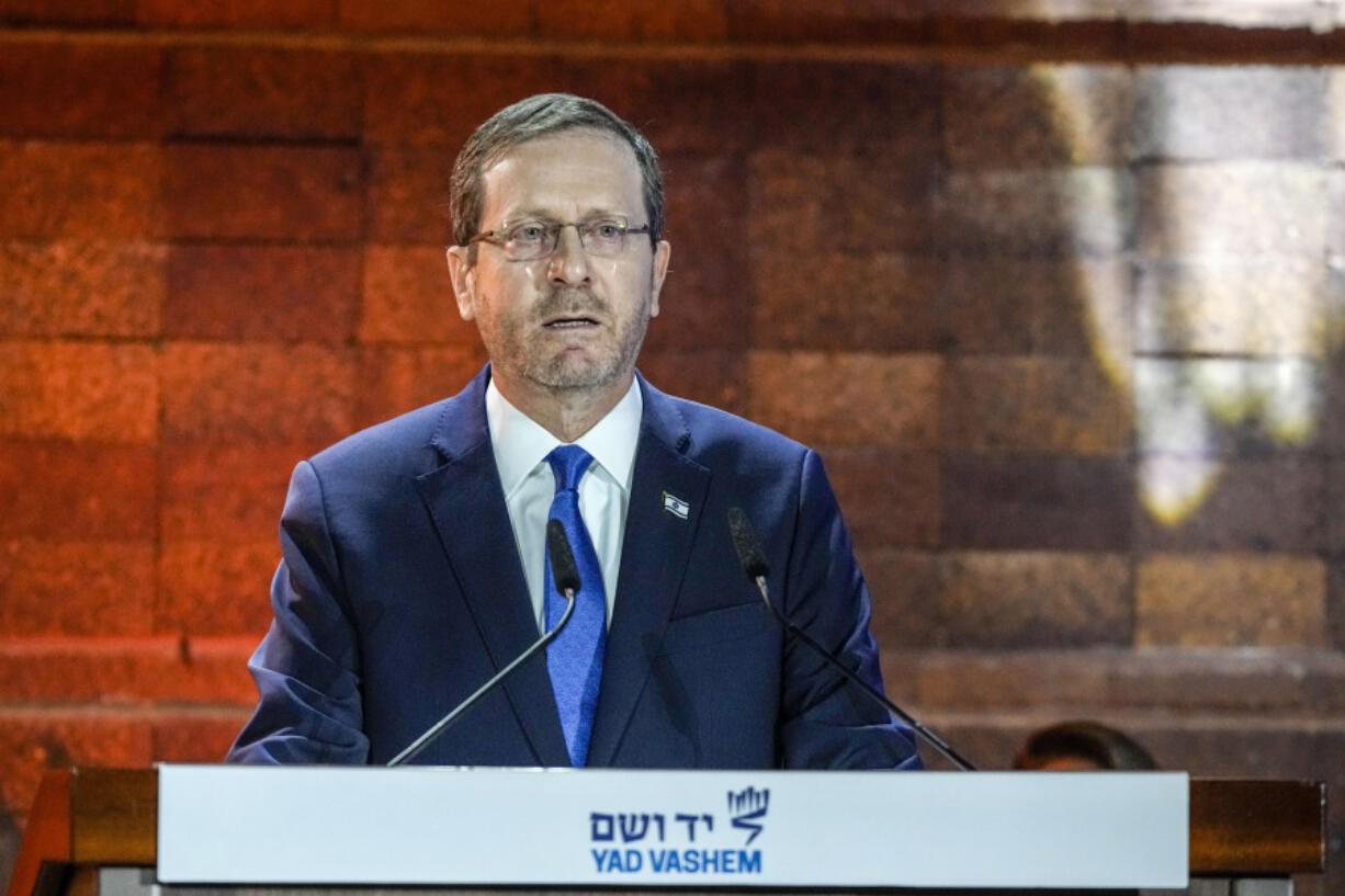 FILE - Israel's President Isaac Herzog delivers a speech during the opening ceremony of the Holocaust Martyrs and Heroes Remembrance Day at Yad Vashem Holocaust Museum in Jerusalem, Monday, April 17, 2023. Israeli President Isaac Herzog will address a joint meeting of Congress on July 19 to commemorate the 75th anniversary of Israel's statehood and to reaffirm the nation's special relationship with the United States, congressional leaders announced Thursday, June 29.