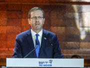 FILE - Israel's President Isaac Herzog delivers a speech during the opening ceremony of the Holocaust Martyrs and Heroes Remembrance Day at Yad Vashem Holocaust Museum in Jerusalem, Monday, April 17, 2023. Israeli President Isaac Herzog will address a joint meeting of Congress on July 19 to commemorate the 75th anniversary of Israel's statehood and to reaffirm the nation's special relationship with the United States, congressional leaders announced Thursday, June 29.