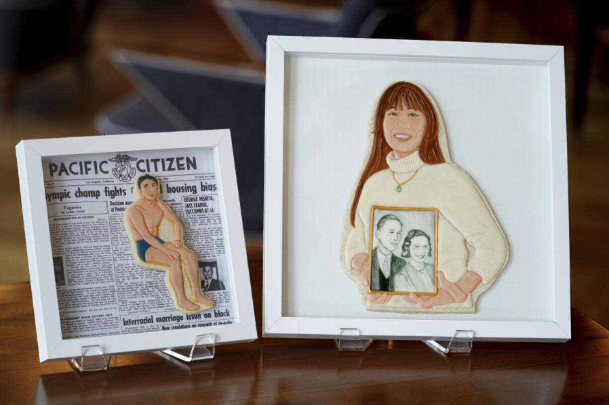 Cookie portraits of US Olympic gold medal winner Sammy Lee, left, and Pittsburgh Asian American activist Karen Fung Yee, created by  Jasmine Cho, appear in Pittsburgh, Wednesday, May 3, 2023.