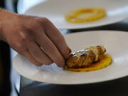 Chef Zach Tyndall prepares Good Meat's cultivated chicken Wednesday at the Eat Just office in Alameda, Calif.