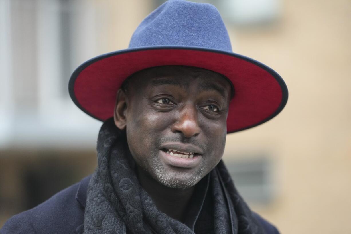 FILE - Yusef Salaam, one of the falsely imprisoned teenagers in the 1989 Central Park jogger case, speaks during a news interview while getting petition signatures for his campaign for New York City Council's 9th District, March 1, 2023, in New York. Some consider Salaam a folk hero as member of the "Central Park Five," the group of teenagers wrongly convicted of raping a white jogger 34 years ago. Now he is banking on his painful past to help win a seat on the New York City Council.