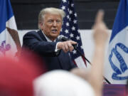 Former President Donald Trump visits with campaign volunteers at the Grimes Community Complex Park, Thursday, June 1, 2023, in Des Moines, Iowa.