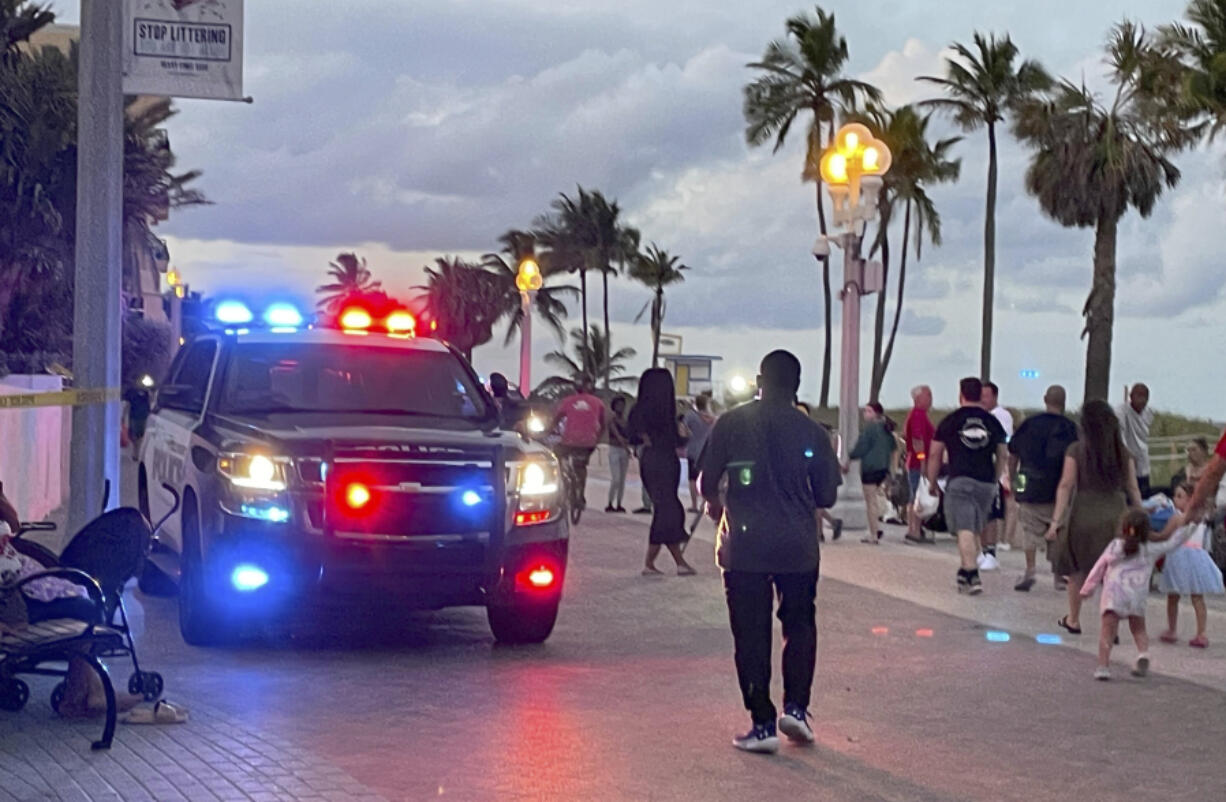 FILE - Police respond to a shooting near the Hollywood Beach Broadwalk in Hollywood, Fla., Monday evening, May 29, 2023.