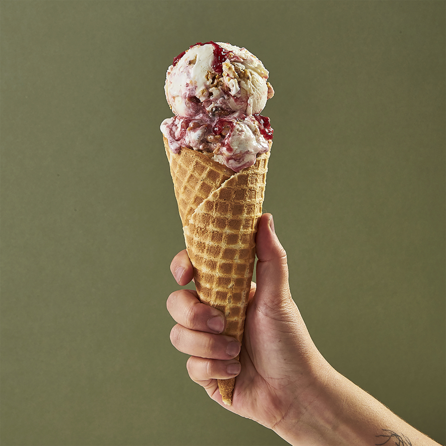This image provided by Salt & Straw shows a cone filled with one of the company's most unique offerings - a Thanksgiving feast in ice cream form, with turkey bacon, buttery brittle and jammy cranberry sauce flavors folded into a creamy base.