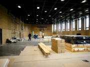 Rabbi Yehuda Teichtal, left, walks through the construction site of a huge indoor basketball court and gym that can be turned into a lecture hall for up to 600 people or a reception hall for weddings and bar mitzvahs, inside the new Jewish educational and cultural complex in Berlin, Germany, Monday, June 12, 2023. The Pears Jewish Campus, run by the local Chabad community, is located in the German capital's Wilmersdorf neighbourhood and will be officially opened Sunday, June 25, 2023.