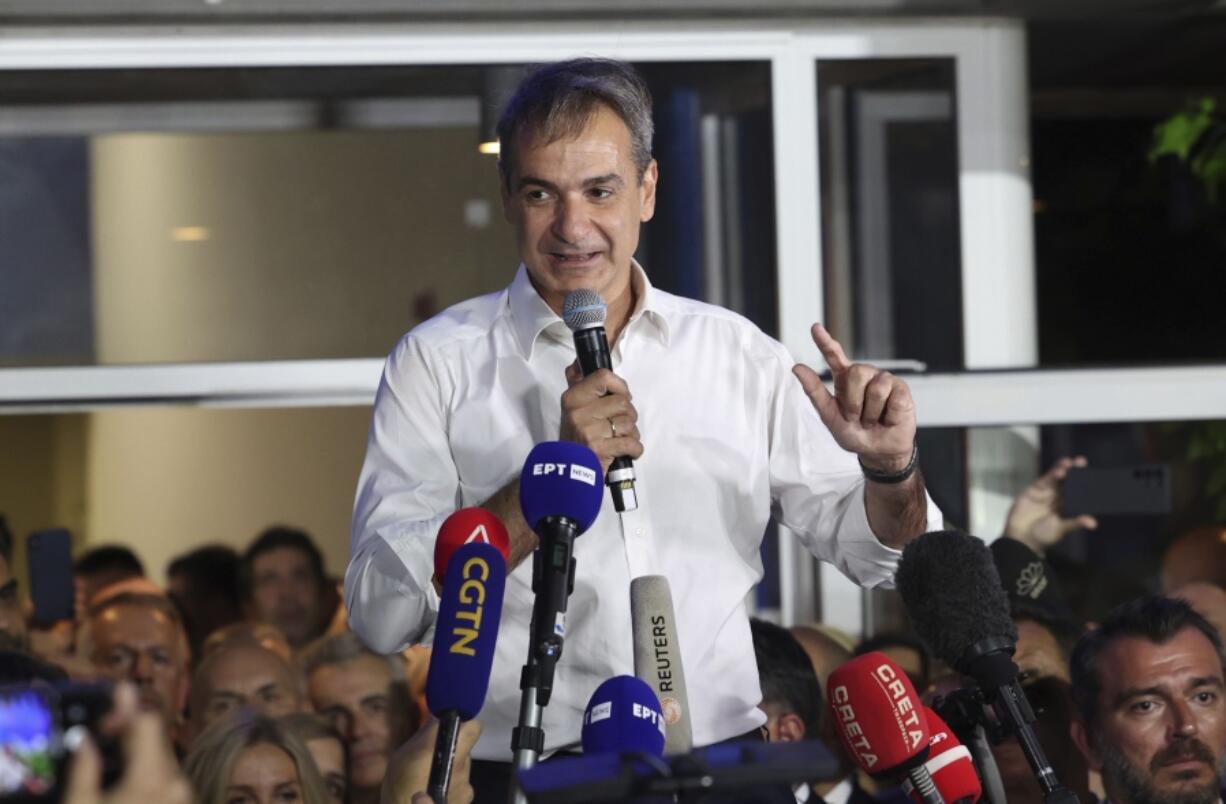 Kyriakos Mitsotakis leader of the center-right New Democracy speaks to supporters outside the headquarters of the party in Athens, Greece, Sunday, June 25, 2023. Greece's conservative New Democracy party has won a landslide victory in the country's second election in five weeks, with partial official results showing it gaining a comfortable parliamentary majority to form a government for a second four-year term.