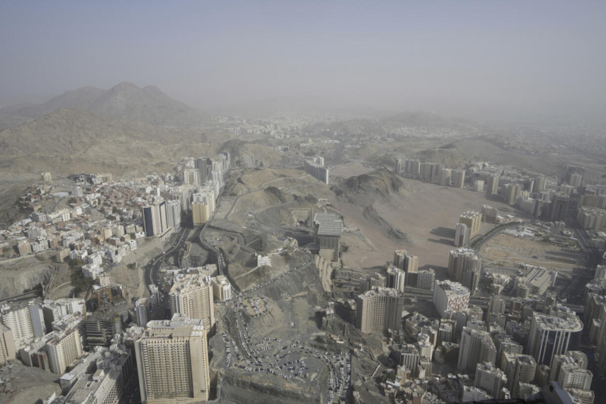 A general view shows the Muslim holy city of Mecca, Saudi Arabia, Sunday, June 25, 2023. Mecca is Islam's most sacred city and a focal point for the faith's followers. But it's also a place where around 2 million people live, work, and do everyday activities like laundry, grocery shopping, homework, putting the trash out, and paying the bills. Traffic, the population, and prices balloon during the peak Ramadan and Hajj seasons.