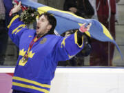 FILE - Sweden's goalie Henrik Lundqvist celebrates after beating Finland 3-2 to win the gold medal in the 2006 Winter Olympics men's ice hockey gold medal game in Turin, Italy, Feb. 26, 2006. Henrik Lundqvist is expected to be elected to the Hockey Hall of Fame in his first year of eligibility.  (AP Photo/Gene J.