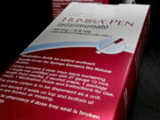 FILE - Packaging for AbbVie's drug, Humira, is photographed in Houston on  July 18, 2014. Patients who take the autoimmune disease treatment may see some price relief when several lower-cost, biosimilar versions of the AbbVie drug reach the U.S. market in July 2023. (AP Photo/David J.