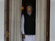 Indian Prime Minister Narendra Modi leaves to receive Nepal's Prime Minister Pushpa Kamal Dahal before their meeting in New Delhi, India, Thursday, June 1, 2023. Dahal arrived Wednesday on a state visit, his first trip abroad since taking power in December last year.