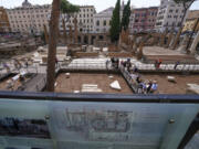 Journalists visit the new walkways of the so called "Sacred Area" where four temples, dating back as far as the 3rd century B.C., stand smack in the middle of one of modern Rome's busiest crossroads Monday.