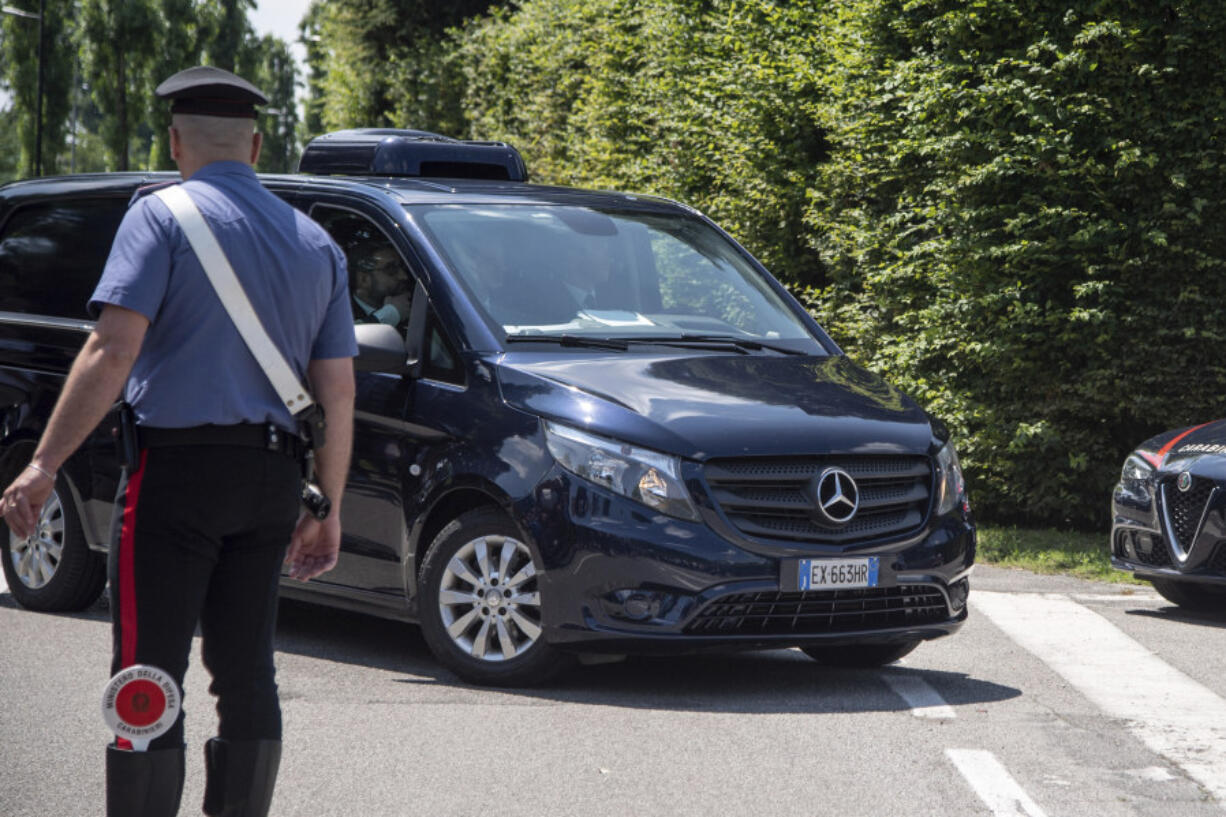 The hearse containing the body of media mogul and former Italian Premier Silvio Berlusconi arrives at Berlusconi's residence in Arcore, near Milan, Italy, Monday June 12, 2023. Silvio Berlusconi, the boastful billionaire media mogul who was Italy's longest-serving premier despite scandals over his sex-fueled parties and allegations of corruption and bribery, has died at age 86.