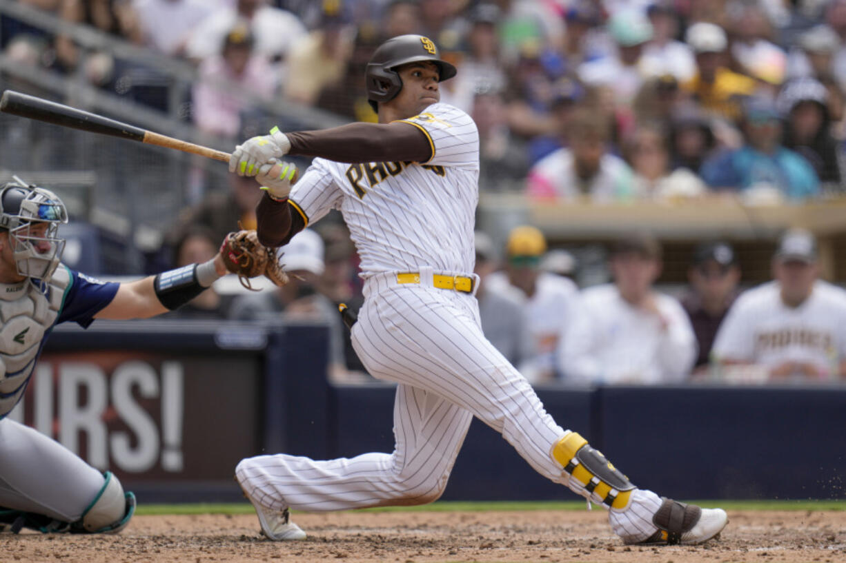 San Diego Padres' Juan Soto watches his two-RBI single during the fifth inning of a baseball game against the Seattle Mariners, Wednesday, June 7, 2023, in San Diego.