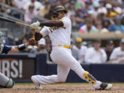 San Diego Padres' Juan Soto watches his two-RBI single during the fifth inning of a baseball game against the Seattle Mariners, Wednesday, June 7, 2023, in San Diego.