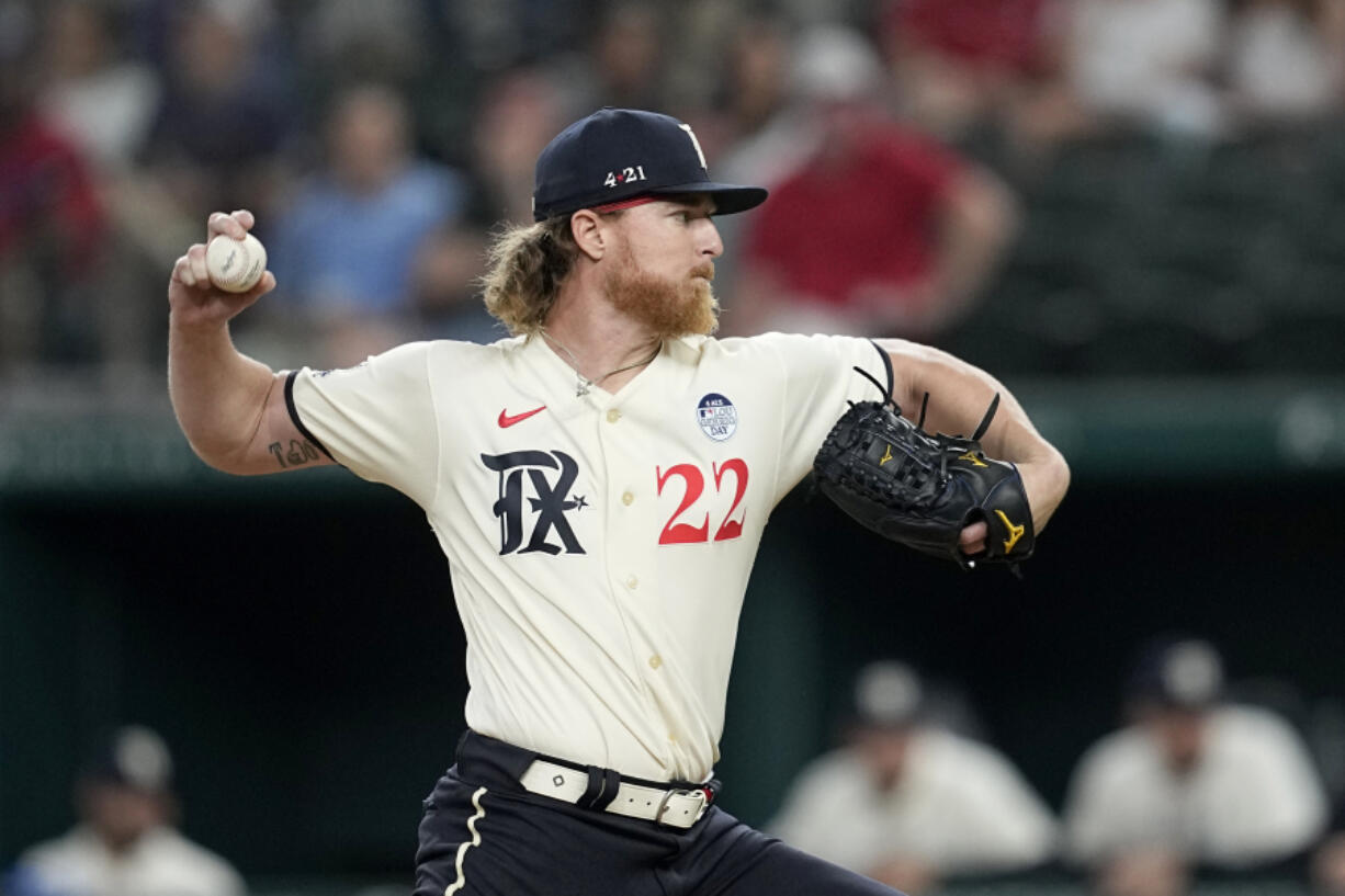 Texas Rangers starting pitcher Jon Gray throws to a Seattle Mariners batter during the first inning of a baseball game Friday, June 2, 2023, in Arlington, Texas.