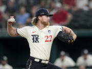 Texas Rangers starting pitcher Jon Gray throws to a Seattle Mariners batter during the first inning of a baseball game Friday, June 2, 2023, in Arlington, Texas.