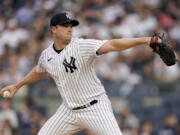 New York Yankees starting pitcher Gerrit Cole (45) throws in the first inning of a baseball game against the Seattle Mariners, Tuesday, June 20, 2023, in New York.