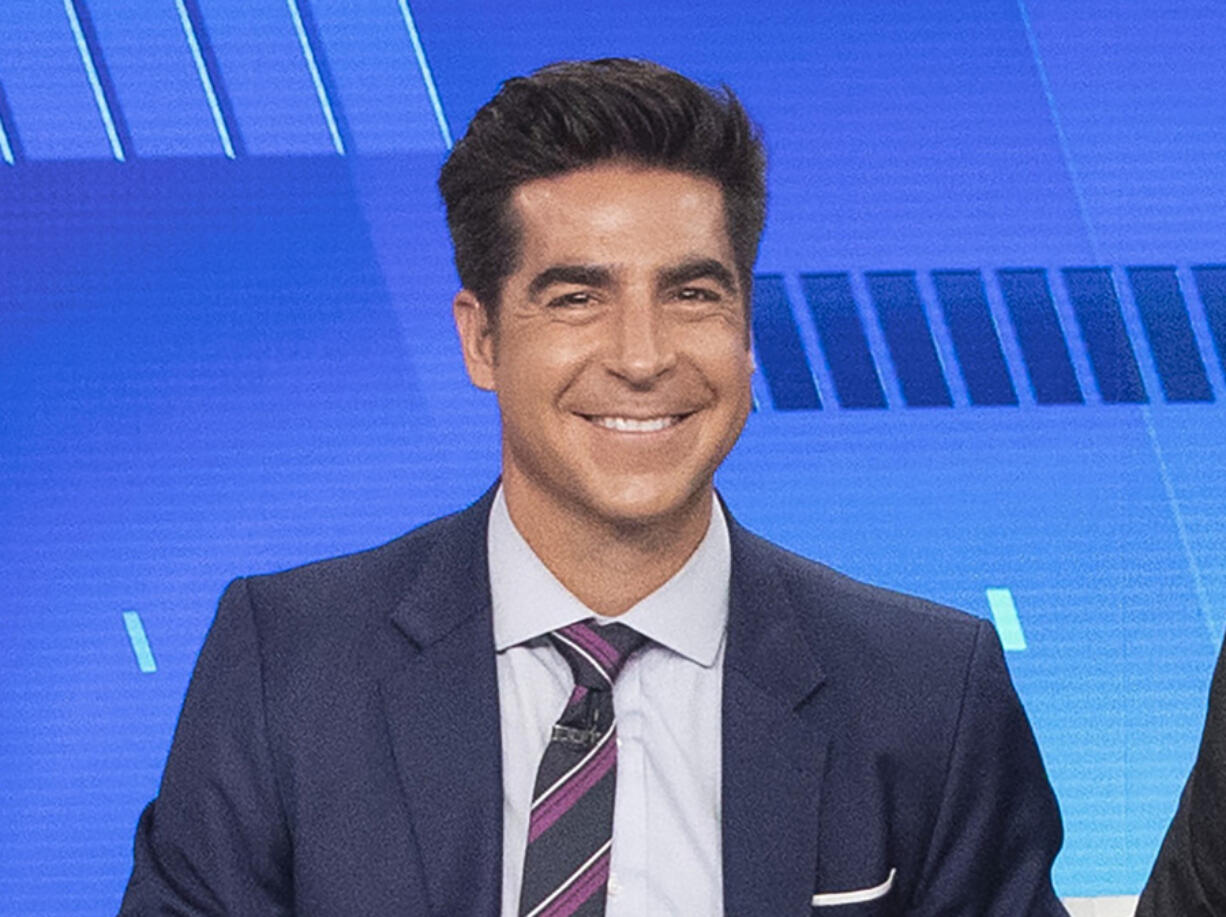 FILE - Jesse Watters appears on Fox News "The Five" in New York on Oct. 10, 2019. Watters will host an opinion show in the time slot formerly occupied by Tucker Carlson, Fox News Channel announced Monday. He will remain a co-host on "The Five," an evening roundtable discussion show that is hugely popular on the network.