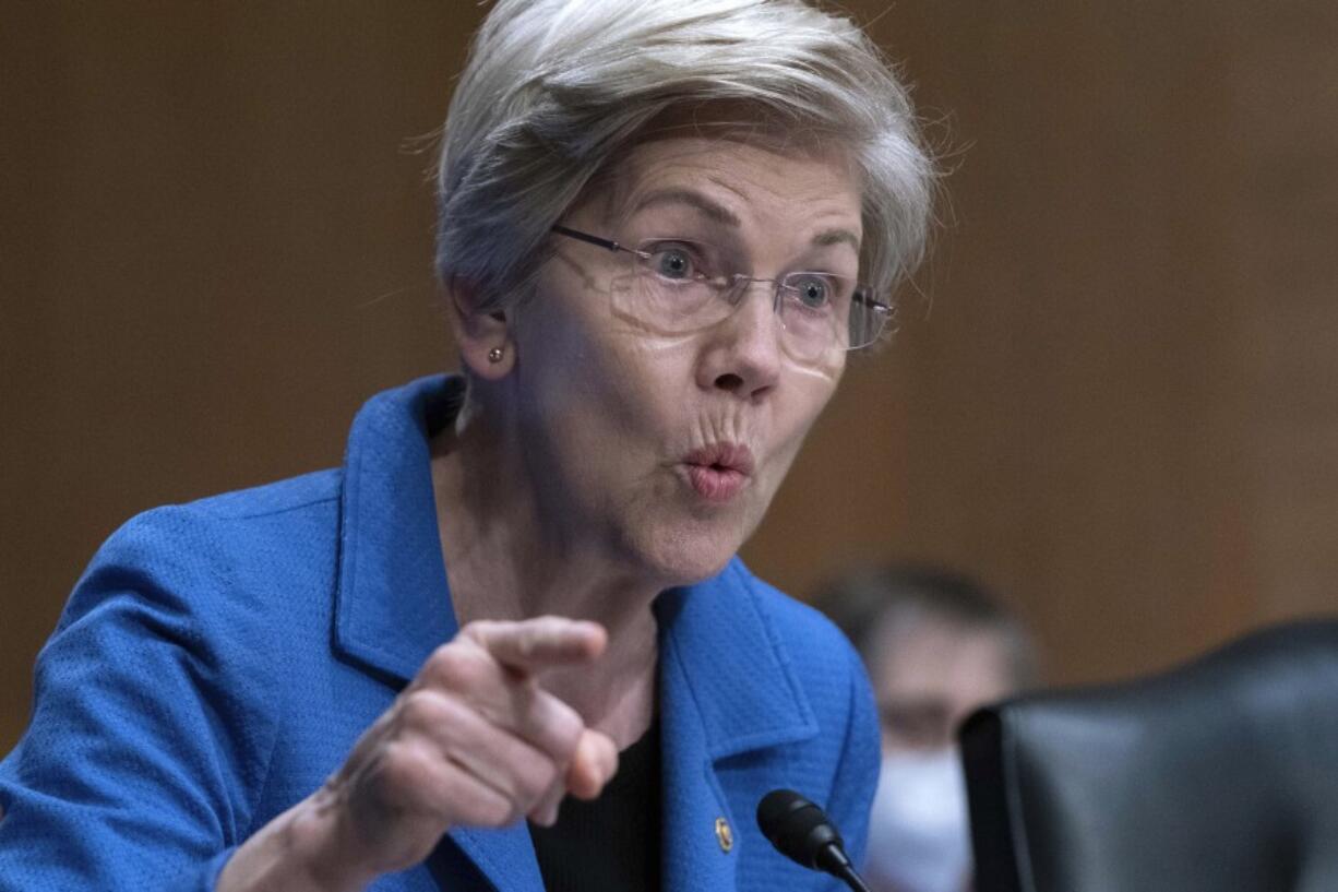 FILE - Sen. Elizabeth Warren, D-Mass., speaks during the Senate Committee on Banking, Housing and Urban Affairs hearing on oversight of the credit reporting agencies at Capitol Hill in Washington, Thursday, April 27, 2023.  A group of Democratic senators is asking the nation's consumer finance watchdog to take action against medical credit cards such as CareCredit, saying use of these cards can result in patients paying much more for their medical care than they should.