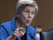 FILE - Sen. Elizabeth Warren, D-Mass., speaks during the Senate Committee on Banking, Housing and Urban Affairs hearing on oversight of the credit reporting agencies at Capitol Hill in Washington, Thursday, April 27, 2023.  A group of Democratic senators is asking the nation's consumer finance watchdog to take action against medical credit cards such as CareCredit, saying use of these cards can result in patients paying much more for their medical care than they should.