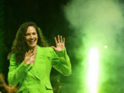 Former Seattle Storm guard Sue Bird waves as she enters the court during her jersey retirement ceremony following a WNBA basketball game between the Storm and the Washington Mystics, Sunday, June 11, 2023, in Seattle.