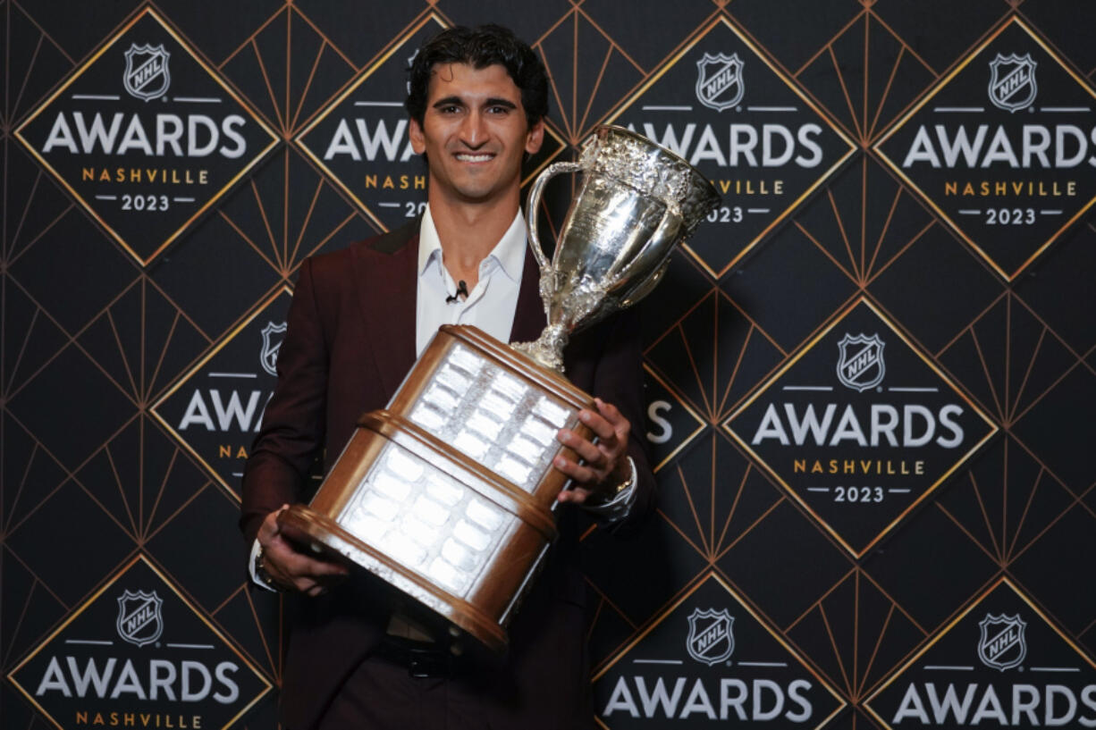 Seattle Kraken hockey player Matty Beniers poses after winning the Calder Memorial Trophy at the NHL Awards, Monday, June 26, 2023, in Nashville, Tenn.