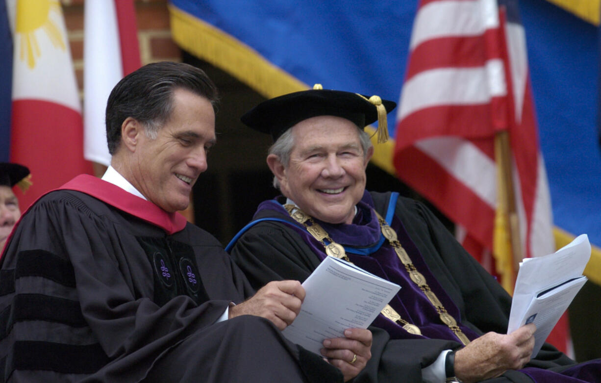 Pat Robertson, right, the founder of Christian Broadcasting Network and the chancellor of Regent University, sits with Republican presidential hopeful Mitt Romney, the former governor of Massachusetts, before Romney delivers the commencement address to the 2007 graduating class of Regent University in Virginia Beach, Va., on May 5, 2007. Robertson died June 8. (Gary C.