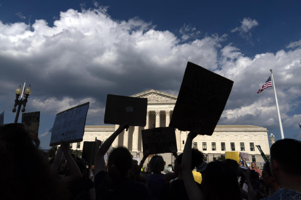 FILE - Abortion-rights activists protest outside the Supreme Court in Washington, Saturday, June 25, 2022. Abortion access groups who received a windfall of donations following the Supreme Court's overturning of Roe v. Wade one year ago say those emergency grants have ended and individual and foundation giving has dropped off.