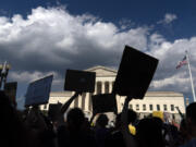 FILE - Abortion-rights activists protest outside the Supreme Court in Washington, Saturday, June 25, 2022. Abortion access groups who received a windfall of donations following the Supreme Court's overturning of Roe v. Wade one year ago say those emergency grants have ended and individual and foundation giving has dropped off.