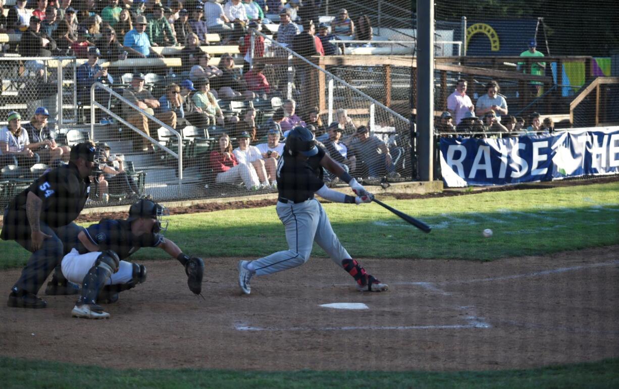 Ridgefield Raptors catcher Isaac Lovings swings at a pitch against the Portland Pickles on Tuesday, June 13, 2023 at Walker Stadium in Portland.