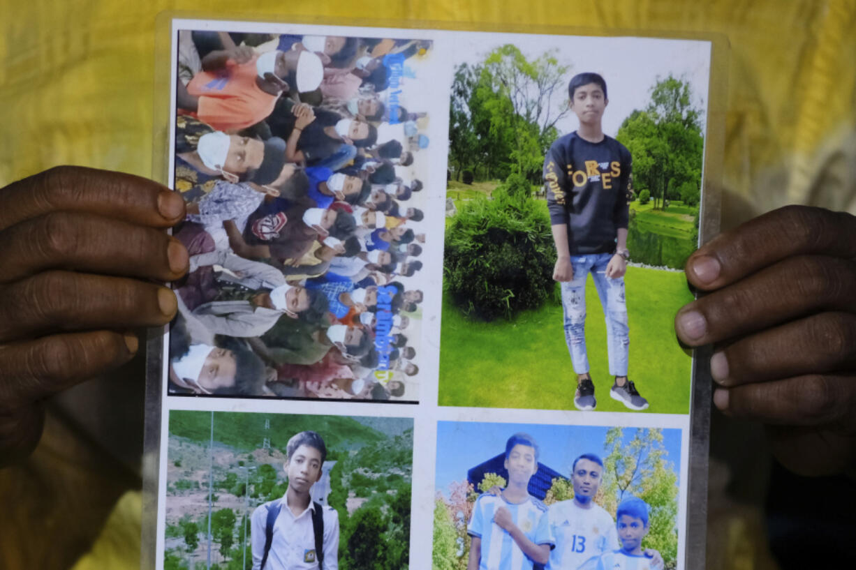 Rohingya refugee Muhammed Rashid holds photos of his son, Saiful Islam, at the Nayapara refugee camp in the Cox's Bazar district of Bangladesh, on March 7, 2023. Rashid believes he sees Saiful in the photo of a group of Rohingya refugees in Indonesia he found online, at top left.