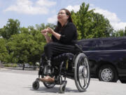 Sen. Tammy Duckworth, D-Ill., speaks with visitors Tuesday, June 13, 2023, on Capitol Hill in Washington.