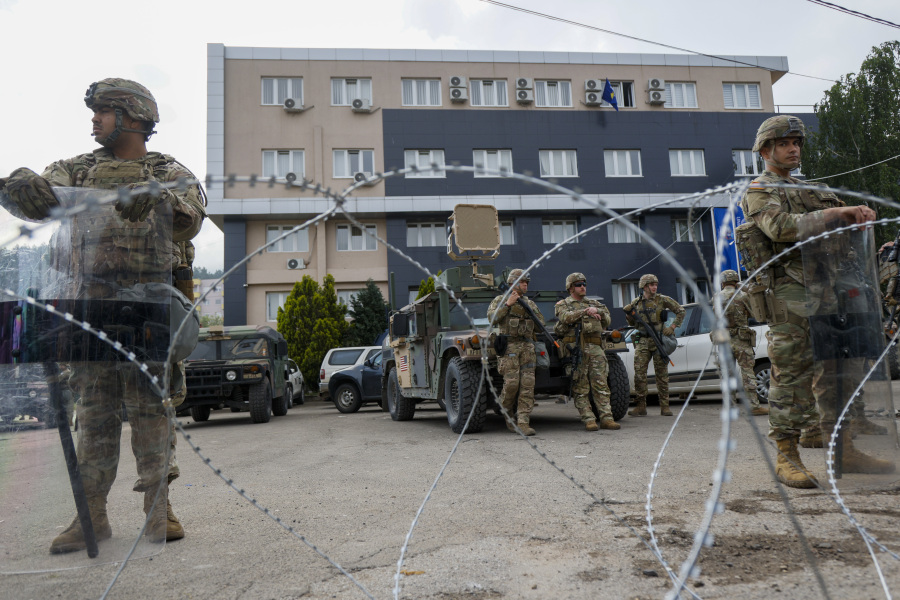 Serbian police fire tear gas at protesters threatening to storm city hall