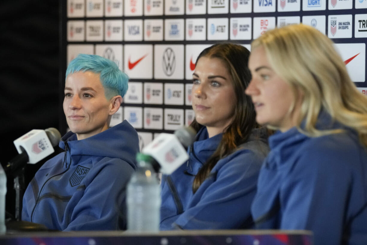 From left, Megan Rapinoe, Alex Morgan, and Lindsey Horan speak to reporters during the 2023 Women's World Cup media day for the United States Women's National Team in Carson, Tuesday, June 27, 2023.