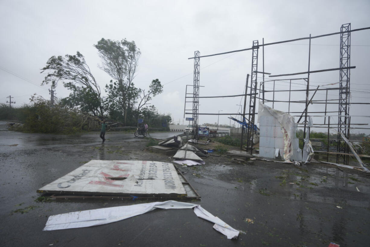 A big hoarding is seen on the ground following heavy winds and incessant rains after landfall of cyclone Biparjoy at Mandvi in Kutch district of Western Indian state of Gujarat, Friday, June 16, 2023. Cyclone Biparjoy knocked out power and threw shipping containers into the sea in western India on Friday before aiming its lashing winds and rain at part of Pakistan that suffered devastating floods last year.