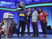 Dev Shah, 14, from Largo, Fla., celebrates winning the Scripps National Spelling Bee alongside his family, Thursday, June 1, 2023, in Oxon Hill, Md.