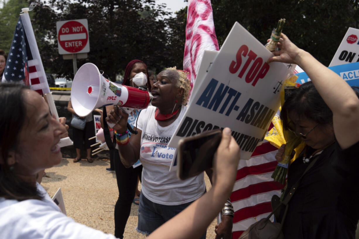 Demonstrators protest outside of the Supreme Court in Washington, Thursday, June 29, 2023, after the Supreme Court struck down affirmative action in college admissions, saying race cannot be a factor.