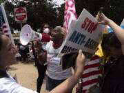 Demonstrators protest outside of the Supreme Court in Washington, Thursday, June 29, 2023, after the Supreme Court struck down affirmative action in college admissions, saying race cannot be a factor.