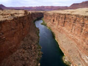 FILE - The Colorado River in the upper River Basin is pictured in Lees Ferry, Ariz., on May 29, 2021.  (AP Photo/Ross D.