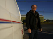 FILE - Gerald Groff, a former postal worker whose case will be argued before the Supreme Court, stands near a mail van outside the United States Post Office in Holtwood, Pa., Wednesday, March 8, 2023. The Supreme Court on Thursday, June 29, used the case of a Christian mailman who didn't want to work Sundays to solidify protections for workers who are religious. In a unanimous decision the justices made clear that workers who ask for religious accommodations, such as taking the Sabbath off, should get them unless their employers show doing so would result in "substantial increased costs" to the business.