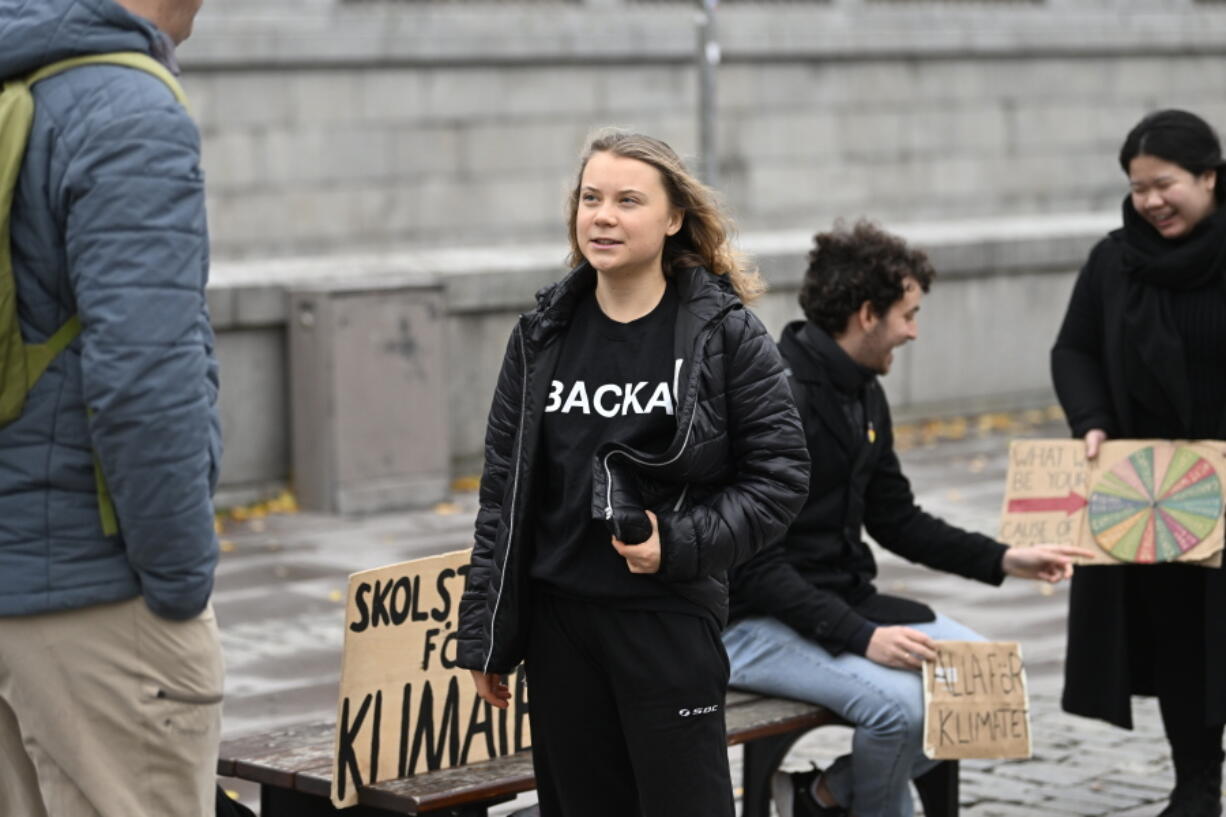 FILE - Climate activist Greta Thunberg arrives at the weekly Fridays for Future demonstration at the Mynttorget square next to the Swedish Parliament Riksdagen, in Stockholm, Sweden, on Nov. 11, 2022. Thunberg said Friday June 9, 2023 she will no longer be able to skip classes as a way to draw attention to climate change because she is graduating from high school.