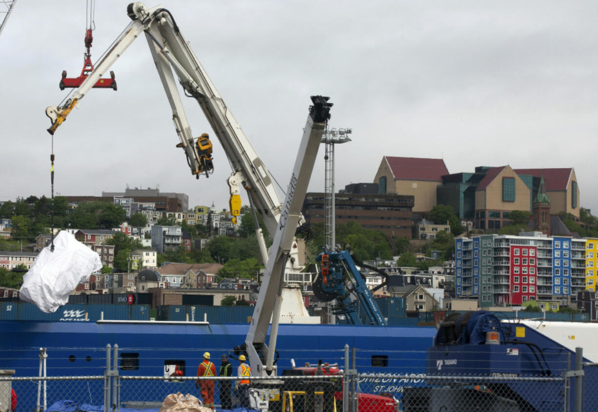 Debris from the Titan submersible, recovered from the ocean floor near the wreck of the Titanic, is unloaded from the ship Horizon Arctic at the Canadian Coast Guard pier in St. John's, Newfoundland, Wednesday, June 28, 2023.