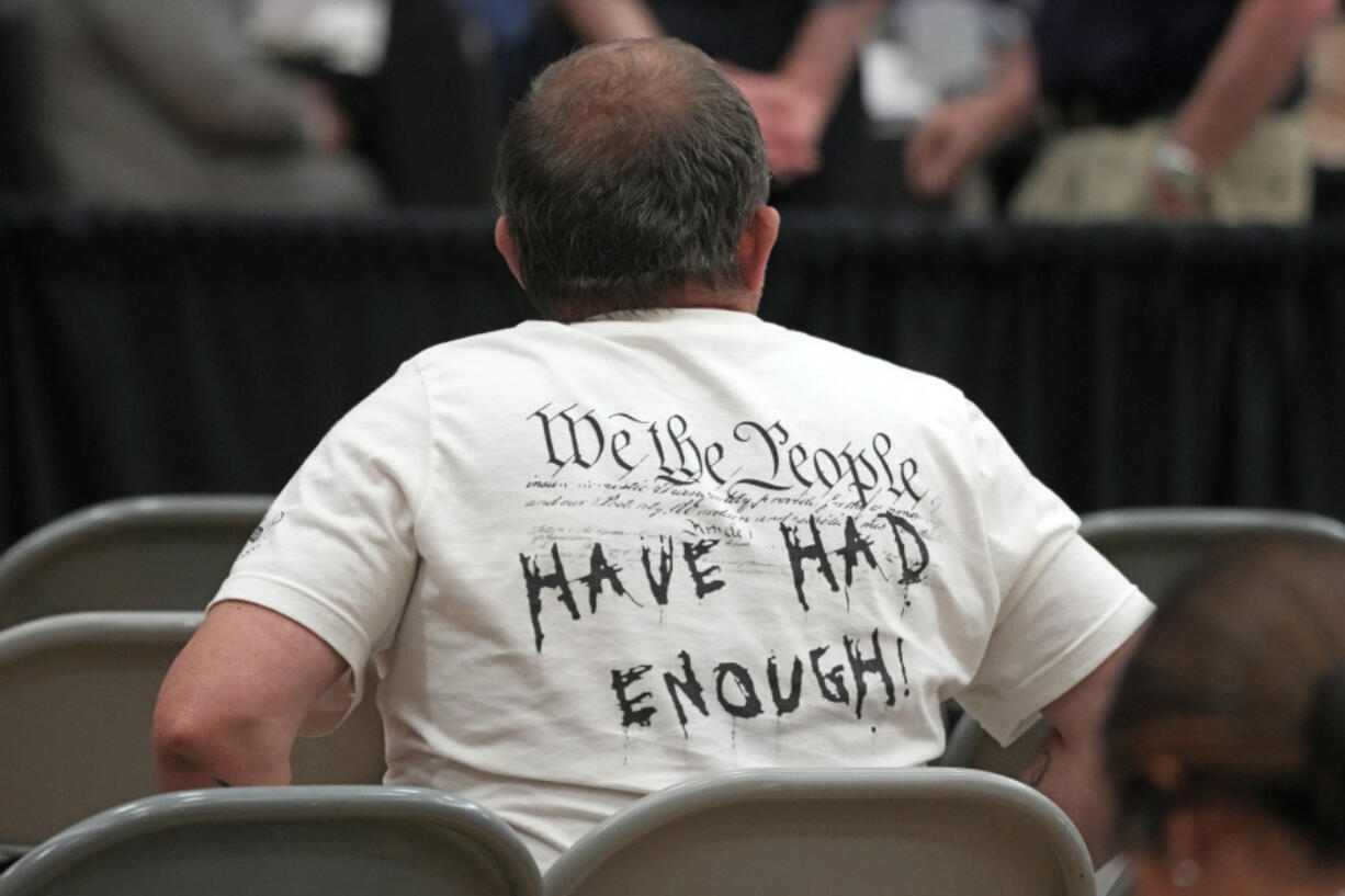 East Palestine, Ohio resident Eric Cozza attends the National Transportation Safety Board investigative hearing at the East Palestine High School in East Palestine, Ohio, Thursday, June 22, 2023. The hearing is being held to investigate the Feb. 3, 2023, Norfolk Southern Railway train derailment and subsequent hazardous material release and fires. (AP Photo/Gene J.