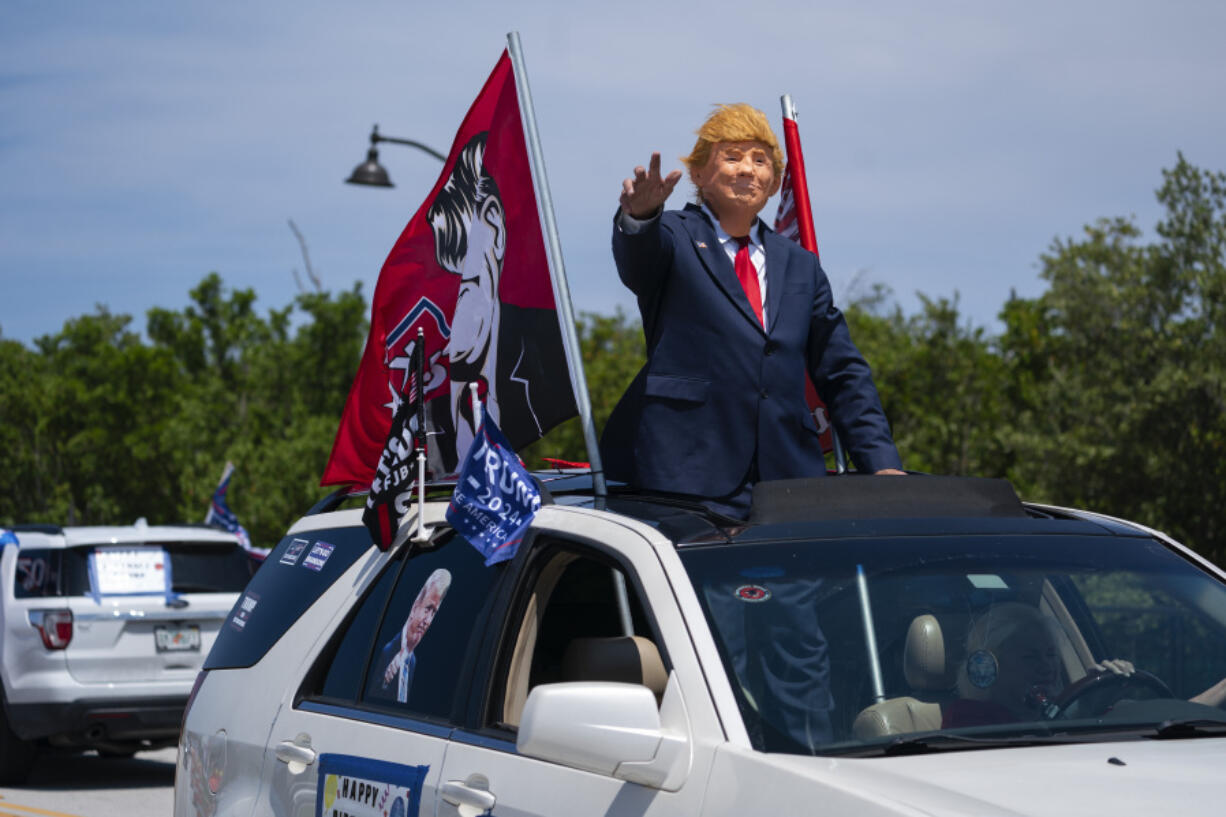 Supporters of former President Donald Trump gather outside Mar-A-Lago, Sunday, June 11, 2023, in Palm Beach, Fla.