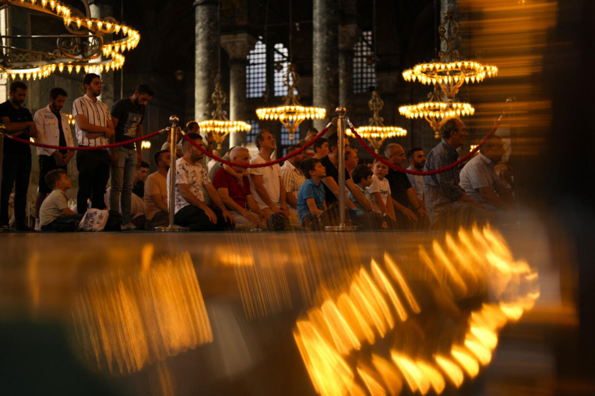 Muslim worshippers pray at Byzantine-era Hagia Sophia mosque during the first day of Eid al-Adha in Istanbul, Turkey, Wednesday, June 28, 2023. Muslims around the world celebrate Eid al-Adha by sacrificing animals to commemorate the prophet Ibrahim's faith in being willing to sacrifice his son.